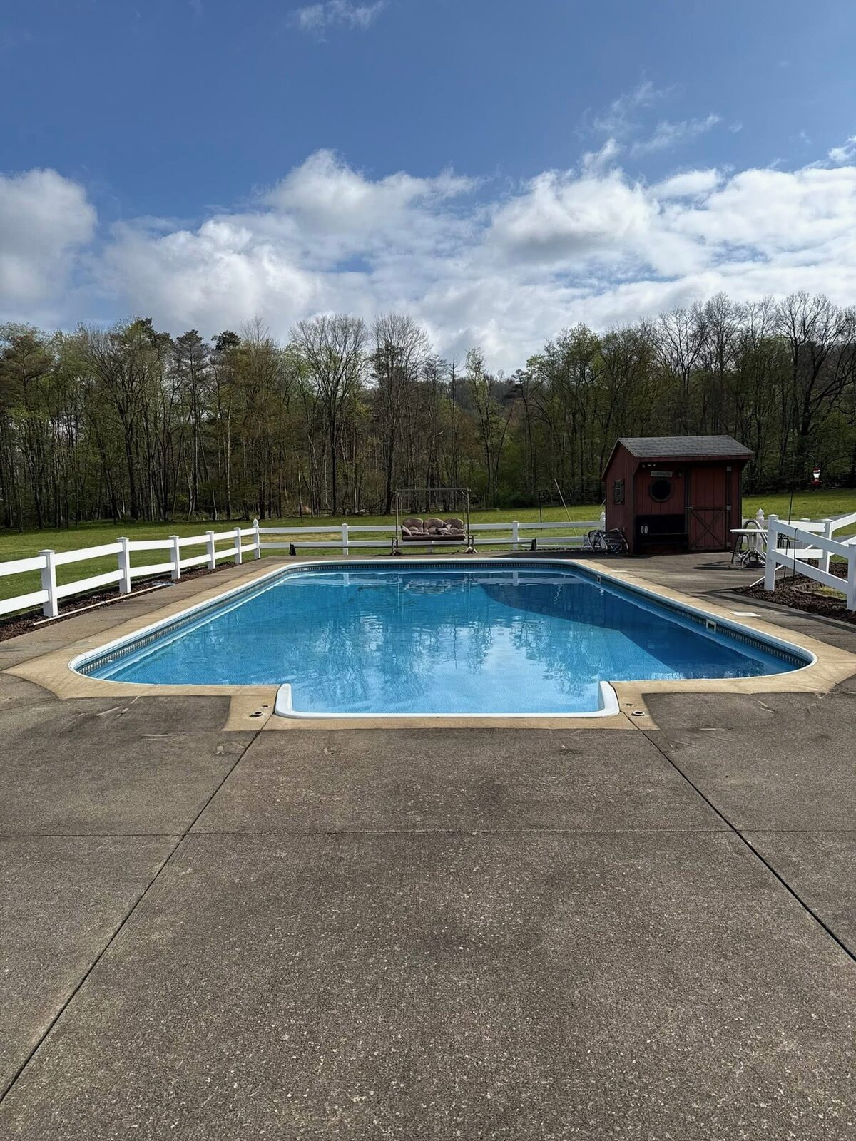 Pool deck before pressure washing — stained and dirty concrete